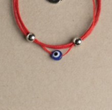 [1253] PULSERAS -- HILO ENCERADO ROJO CON OJITO TURCO